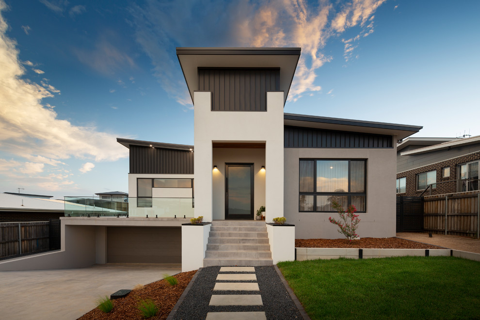 This is an example of a large modern two-storey house exterior in Canberra - Queanbeyan.