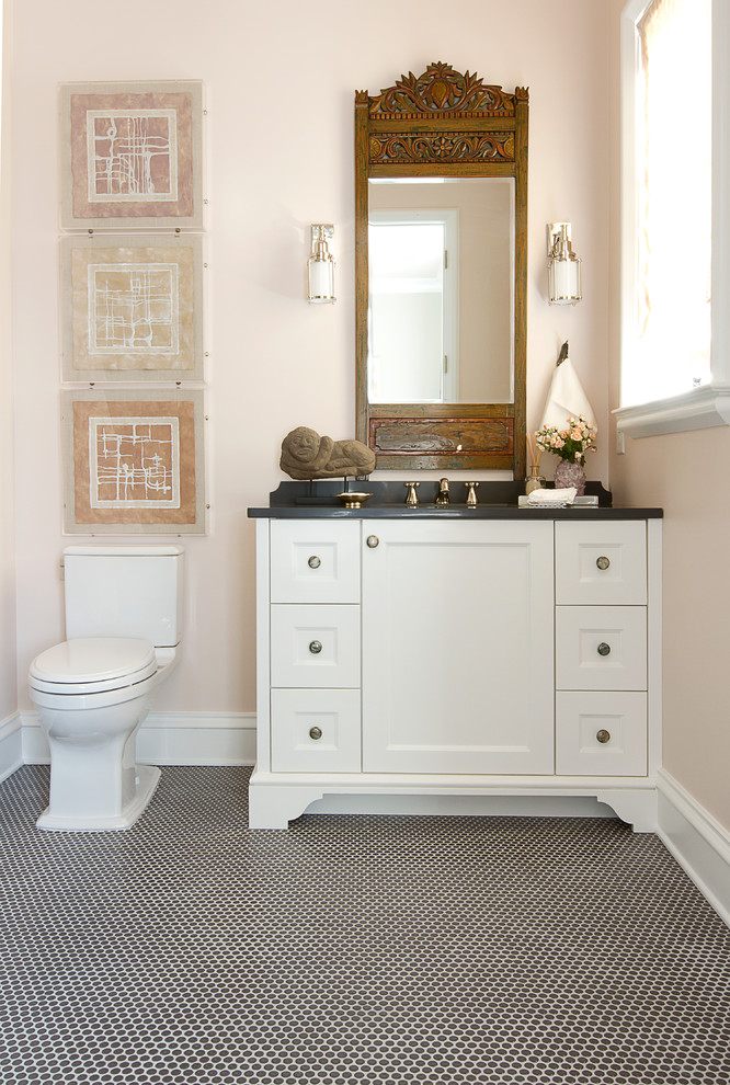 Photo of a mid-sized eclectic 3/4 bathroom in Atlanta with shaker cabinets, white cabinets, an alcove shower, a two-piece toilet, black and white tile, white tile, ceramic tile, beige walls, ceramic floors, an undermount sink and soapstone benchtops.