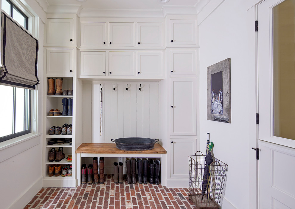 Inspiration for a country mudroom in Atlanta with white walls, brick floors, a dutch front door, a white front door and red floor.