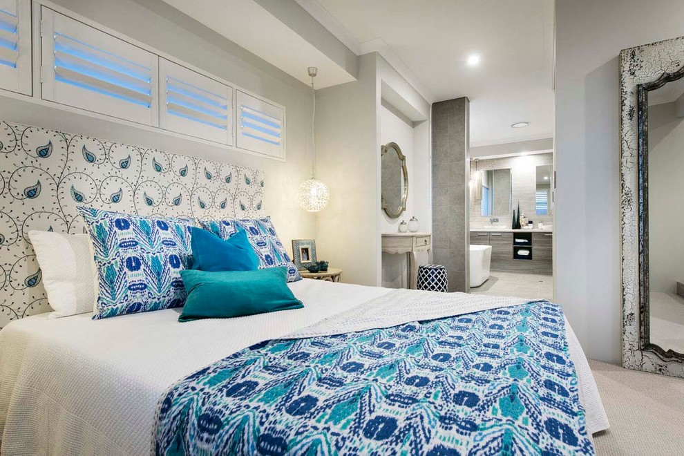 This is an example of a large beach style master bedroom in Perth with carpet and grey walls.