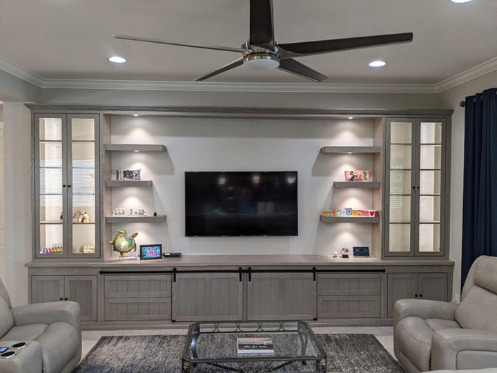 Design ideas for a transitional open concept living room in Tampa with a built-in media wall.