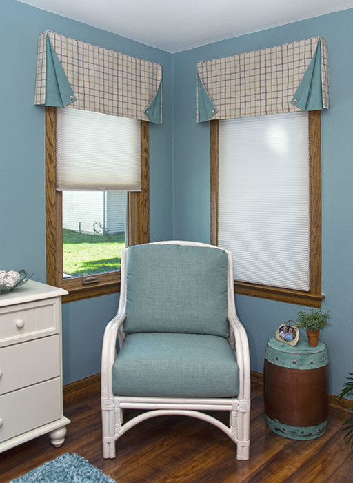 Inspiration for a mid-sized beach style bedroom in Milwaukee with blue walls, dark hardwood floors and no fireplace.