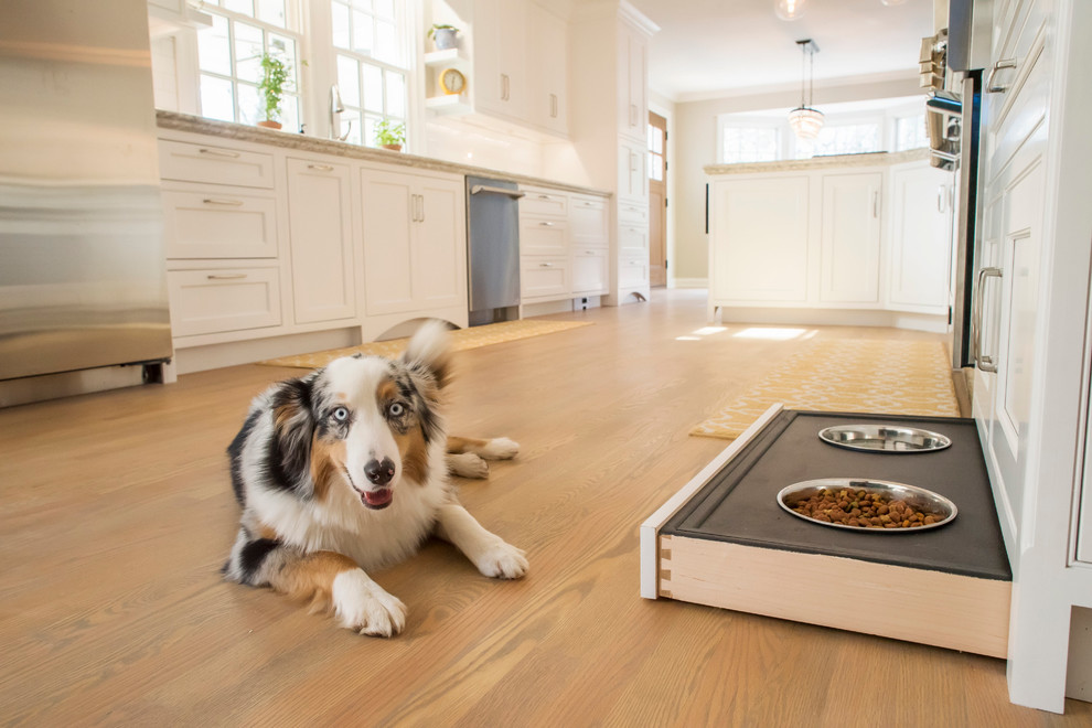 Open concept kitchen - large traditional galley light wood floor open concept kitchen idea in Other with an undermount sink, beaded inset cabinets, white cabinets, quartzite countertops, white backsplash, subway tile backsplash, stainless steel appliances and a peninsula