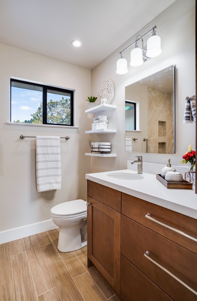 Design ideas for a medium sized traditional bathroom in San Francisco with shaker cabinets, medium wood cabinets, porcelain flooring, engineered stone worktops, brown floors, white worktops, a single sink and a built in vanity unit.