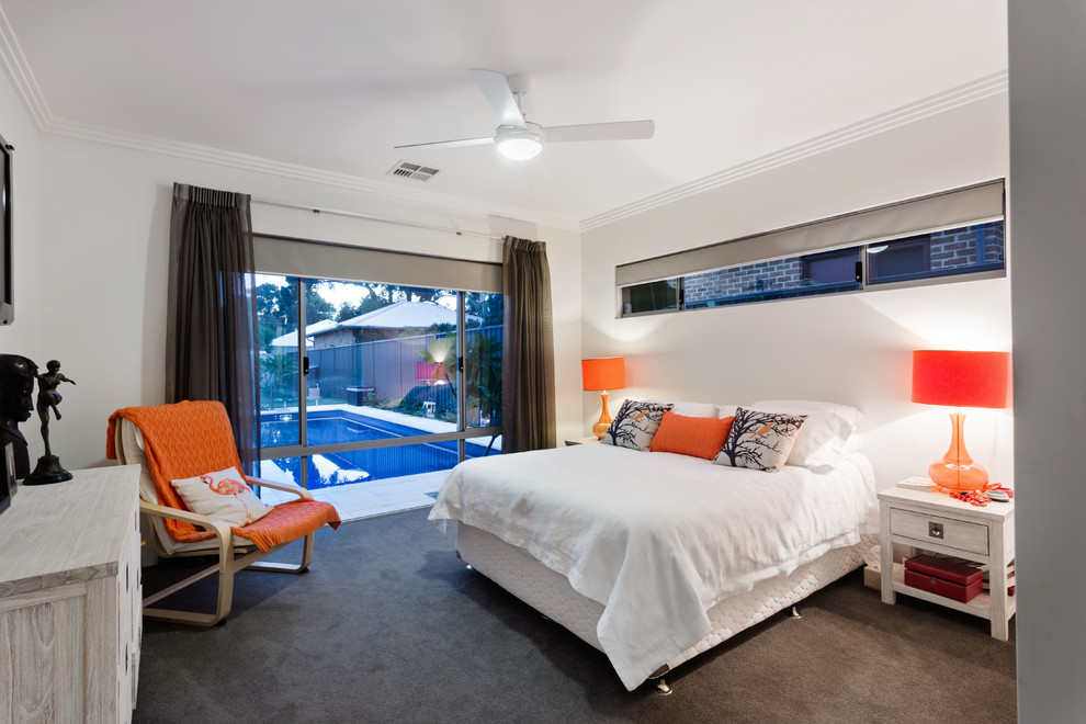 Photo of a large contemporary master bedroom in Perth with white walls and carpet.