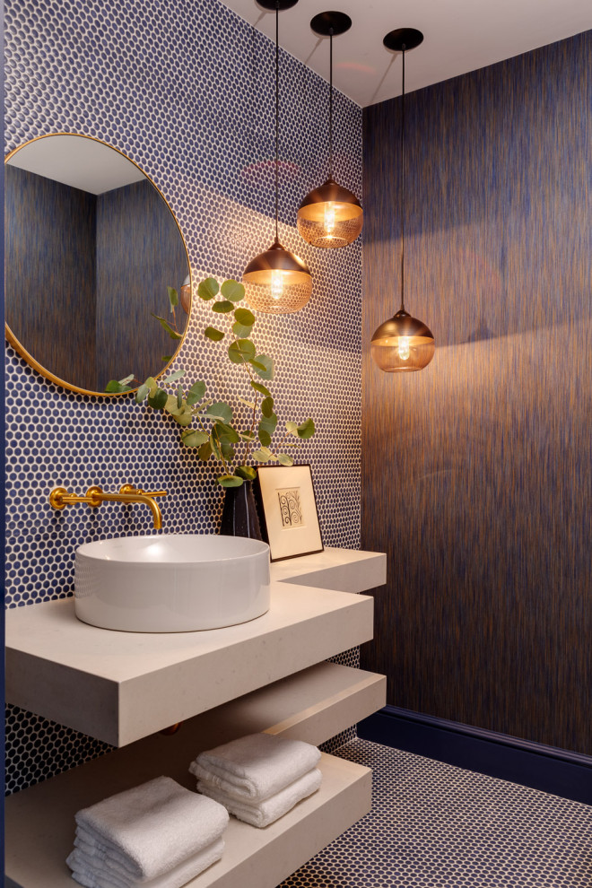 Photo of a contemporary powder room in Boston with blue tile, mosaic tile, brown walls, mosaic tile floors, a vessel sink, blue floor, white benchtops and wallpaper.