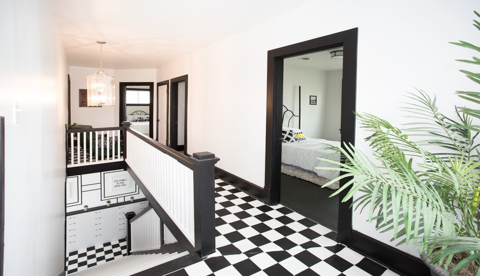 Large transitional vinyl floor and white floor hallway photo with white walls