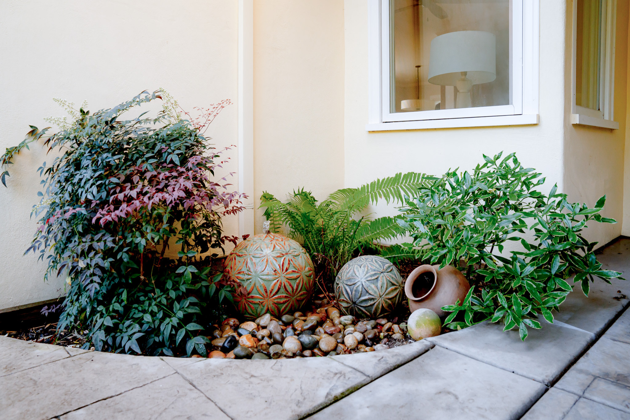 Patio Fountain with Sculptural Accents and Fragrant Plantings