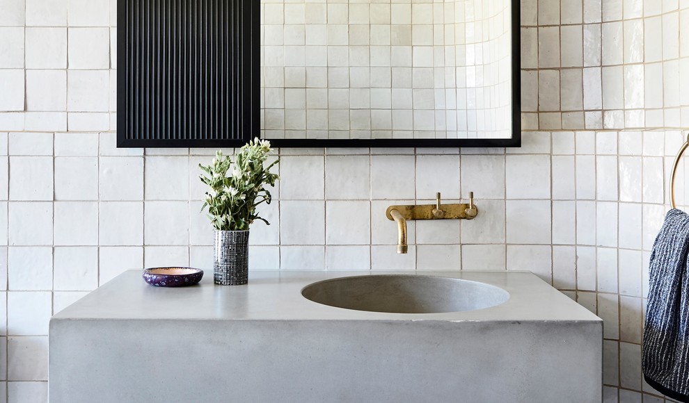 This is an example of a mid-sized contemporary kids bathroom in Melbourne with grey cabinets, ceramic tile, an integrated sink, concrete benchtops and grey benchtops.