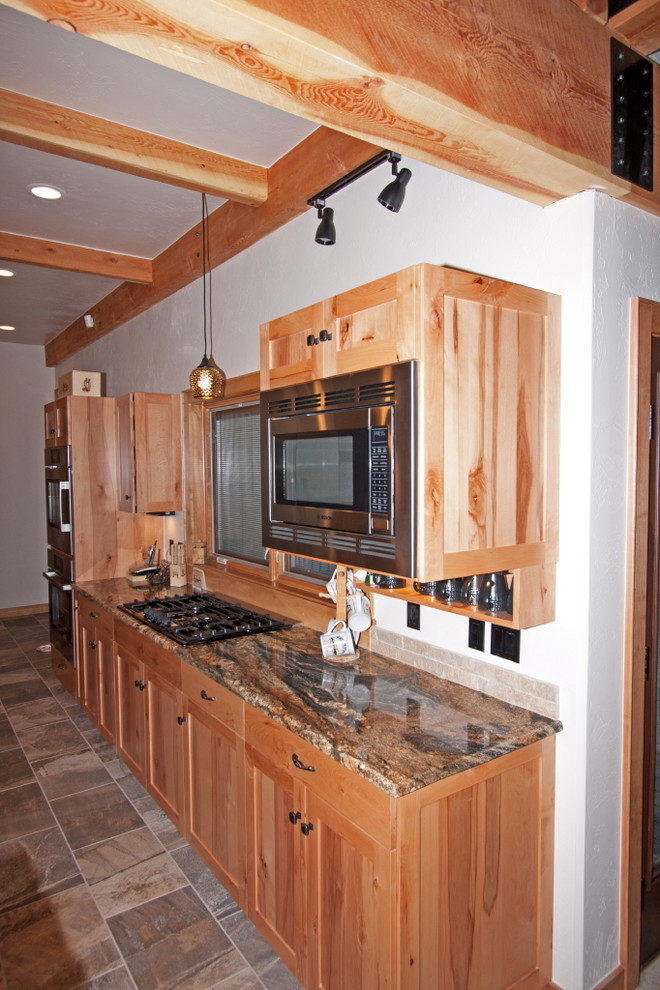 Eat-in kitchen - large rustic u-shaped eat-in kitchen idea with medium tone wood cabinets, an island and shaker cabinets