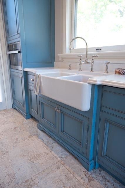 Inspiration for a large rustic u-shaped ceramic tile eat-in kitchen remodel in Toronto with a farmhouse sink, beaded inset cabinets, blue cabinets, quartzite countertops, white backsplash, stone slab backsplash, stainless steel appliances and an island