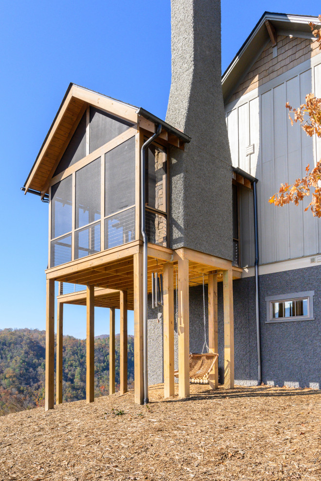 Deck - transitional backyard deck idea with a roof extension