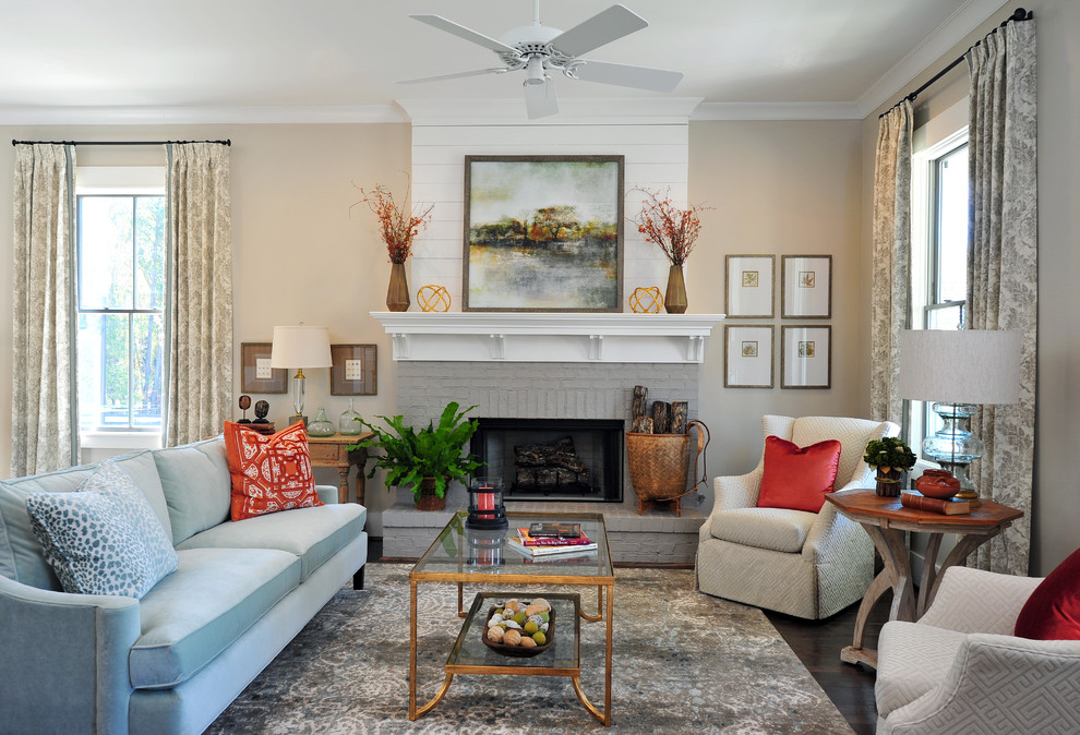 Inspiration for a mid-sized transitional open concept living room in Atlanta with beige walls, medium hardwood floors, a standard fireplace and a brick fireplace surround.