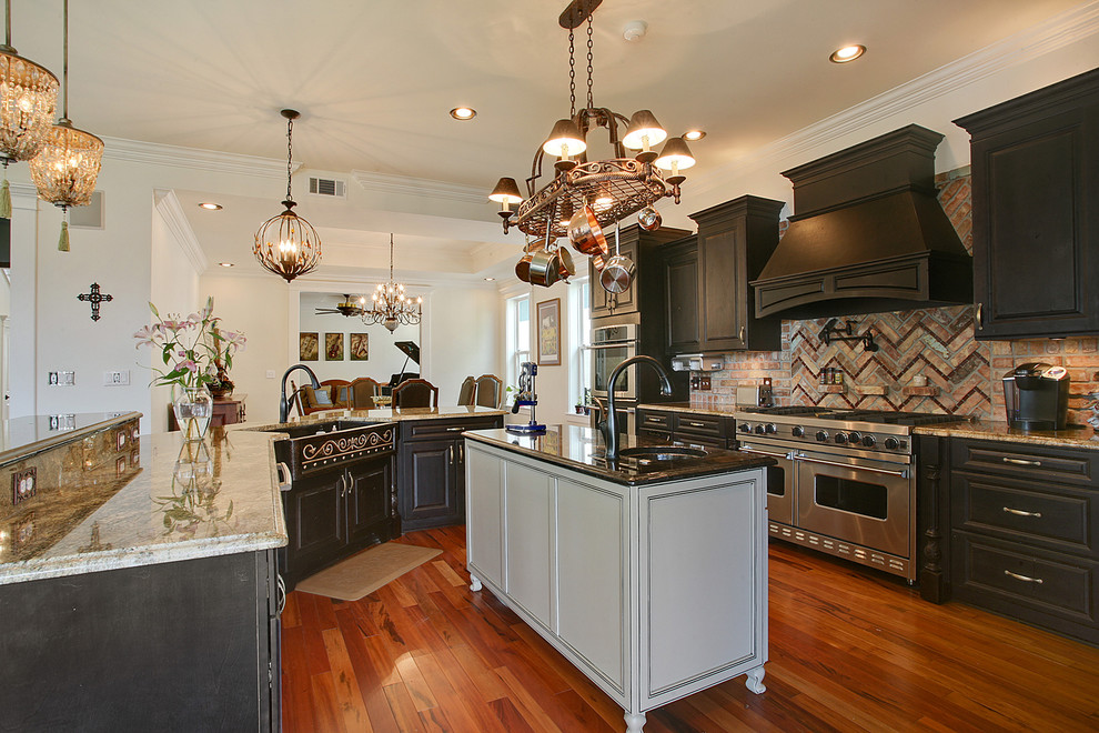 Photo of a traditional kitchen in New Orleans with stainless steel appliances.
