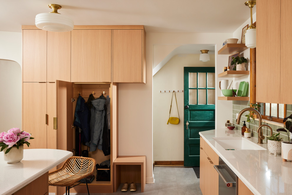 Mid-sized scandinavian galley separate kitchen in Minneapolis with an undermount sink, flat-panel cabinets, light wood cabinets, quartz benchtops, green splashback, ceramic splashback, stainless steel appliances, porcelain floors, a peninsula, grey floor and white benchtop.
