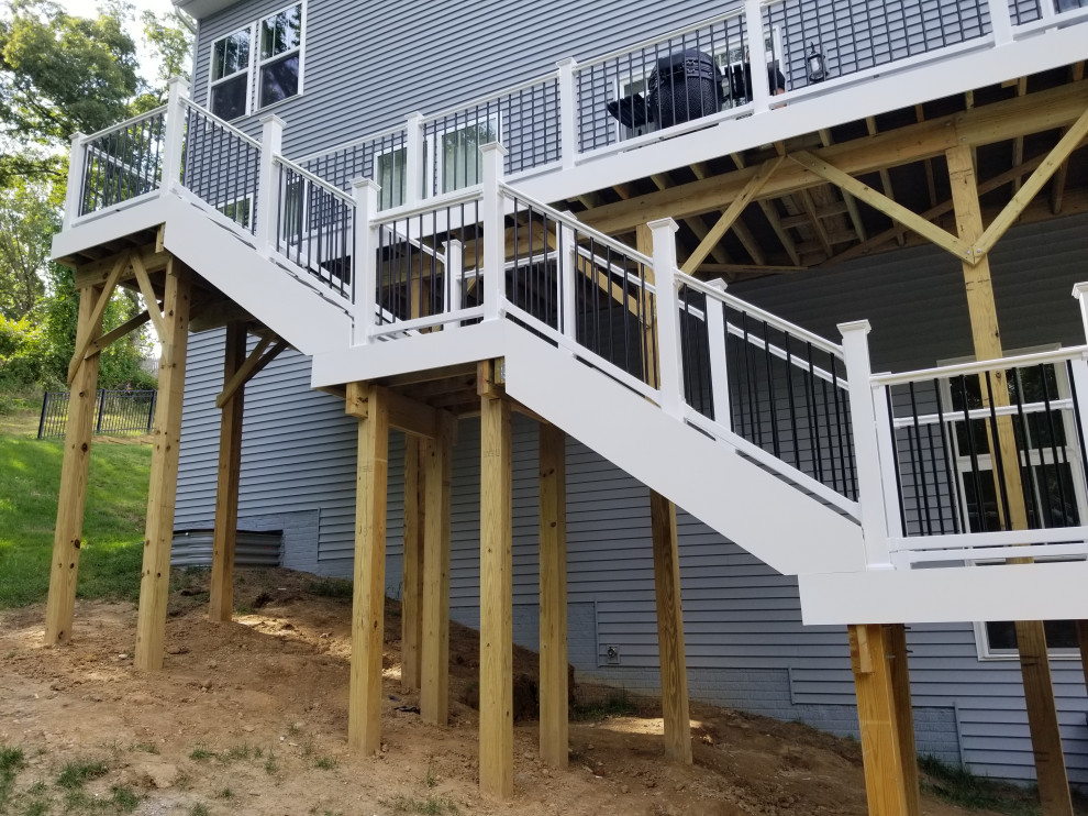 Large transitional backyard deck photo