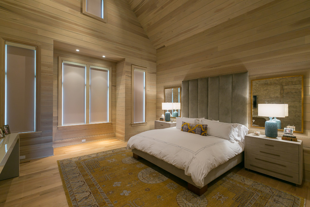 Photo of a contemporary bedroom in Charleston with brown walls, medium hardwood floors and brown floor.