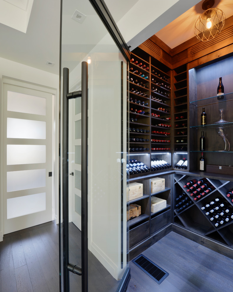 Photo of a transitional wine cellar in Toronto.