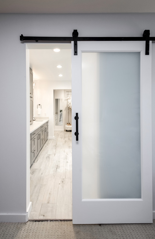 Example of a mid-sized transitional master gray tile and porcelain tile porcelain tile freestanding bathtub design in Seattle with shaker cabinets, gray cabinets, a two-piece toilet, white walls, an undermount sink and quartzite countertops