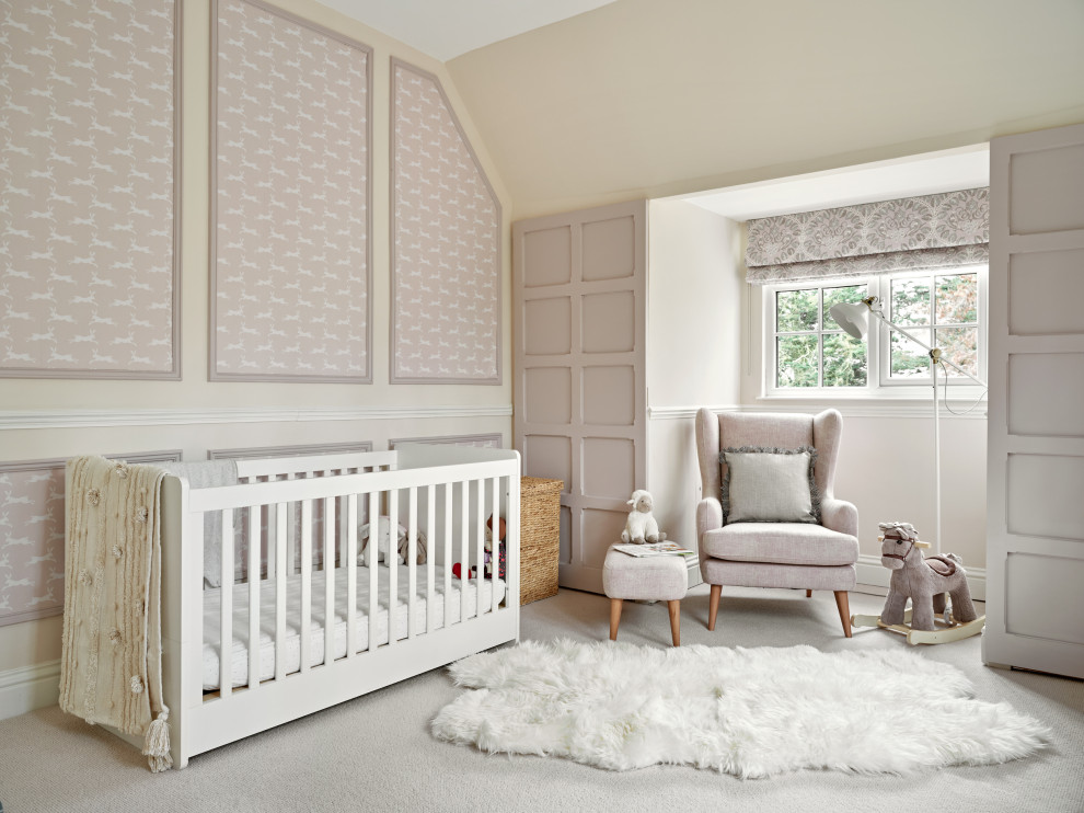 Medium sized traditional nursery for girls in West Midlands with pink walls, carpet, grey floors, a vaulted ceiling, panelled walls and a dado rail.