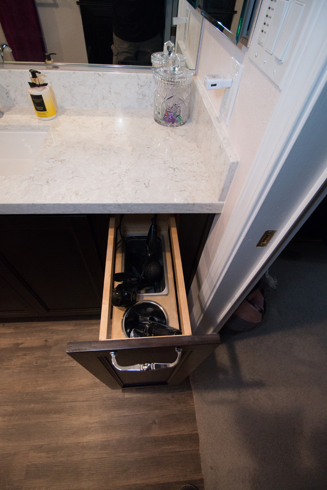Home design - mid-sized transitional master white tile and subway tile brown floor home design idea with flat-panel cabinets, dark wood cabinets, a two-piece toilet, pink walls, an undermount sink and quartz countertops
