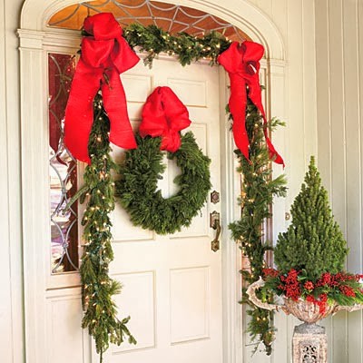 Garland over Door way with Red Ribbon. Alberta Spruce with White Pine and Cranberry picks. Peter Atkins and Associates, LLC