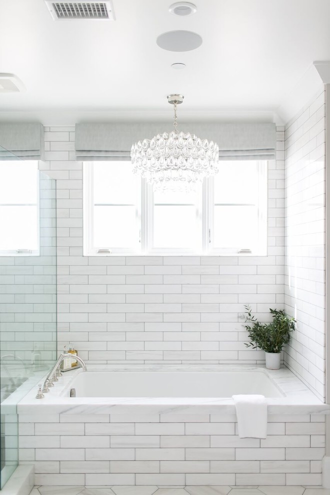 Inspiration for a mid-sized transitional master white tile and porcelain tile porcelain tile and white floor alcove shower remodel in Orange County with shaker cabinets, gray cabinets, an undermount tub, a two-piece toilet, gray walls, an undermount sink, soapstone countertops and a hinged shower door