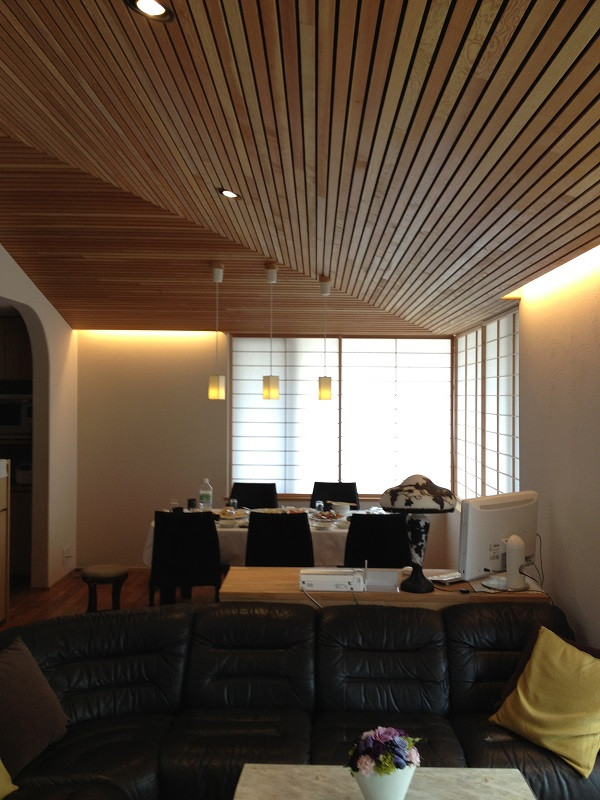 Inspiration for a large dining room in Tokyo Suburbs with medium hardwood flooring.