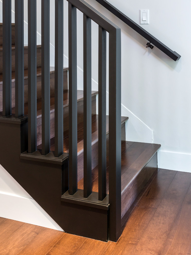 Mid-sized midcentury wood straight staircase in Other with wood risers.