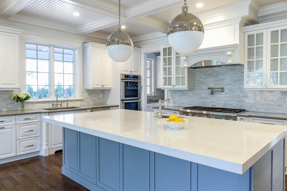 Large transitional u-shaped dark wood floor kitchen photo with shaker cabinets, white cabinets, quartz countertops, white backsplash, marble backsplash, an island and white countertops