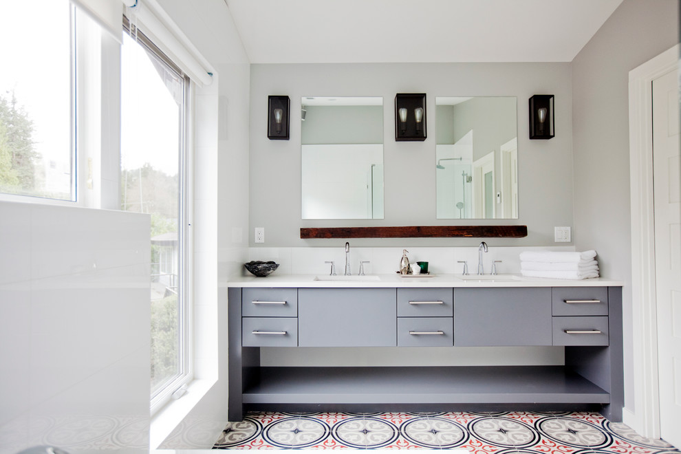 Design ideas for a large transitional master bathroom in Vancouver with flat-panel cabinets, grey cabinets, a drop-in tub, a corner shower, white tile, porcelain tile, white walls, ceramic floors, an undermount sink and engineered quartz benchtops.