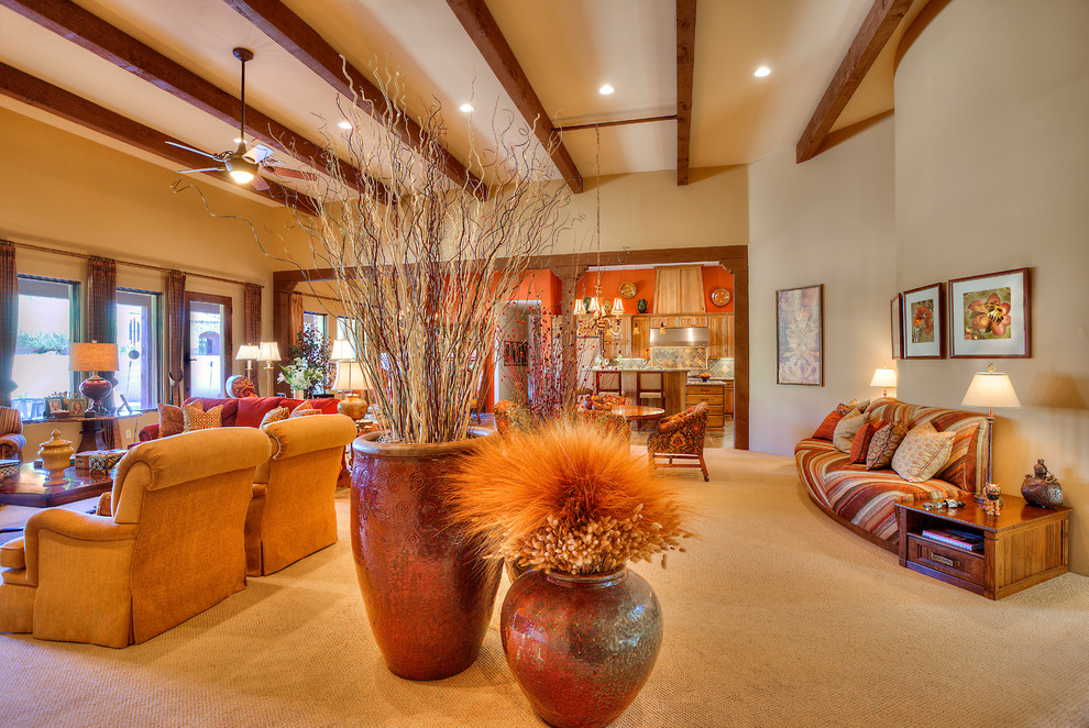 Photo of an expansive traditional open concept family room in Phoenix with carpet, a corner fireplace, a stone fireplace surround and a built-in media wall.