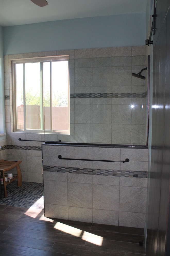 Inspiration for a mid-sized transitional master beige tile and porcelain tile porcelain tile and brown floor walk-in shower remodel in Phoenix with flat-panel cabinets, black cabinets, a two-piece toilet, blue walls, an undermount sink and quartz countertops