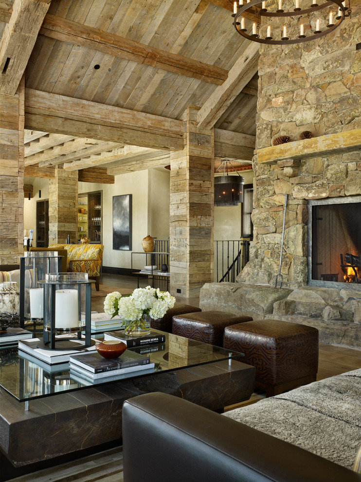 Design ideas for an expansive country open concept living room in Denver with a standard fireplace and a stone fireplace surround.