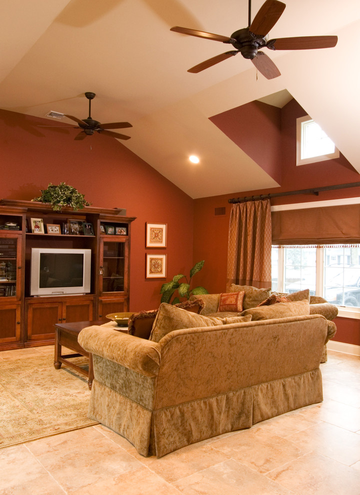 This is an example of a traditional family room in New York with brown walls.