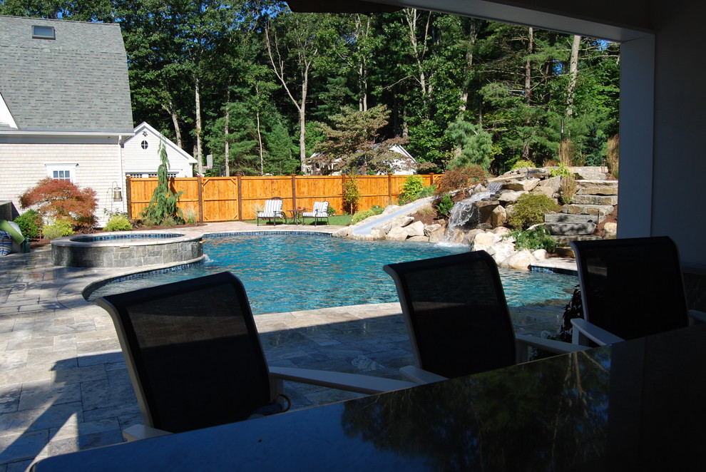 Mid-sized mountain style backyard stone and kidney-shaped natural water slide photo in Boston