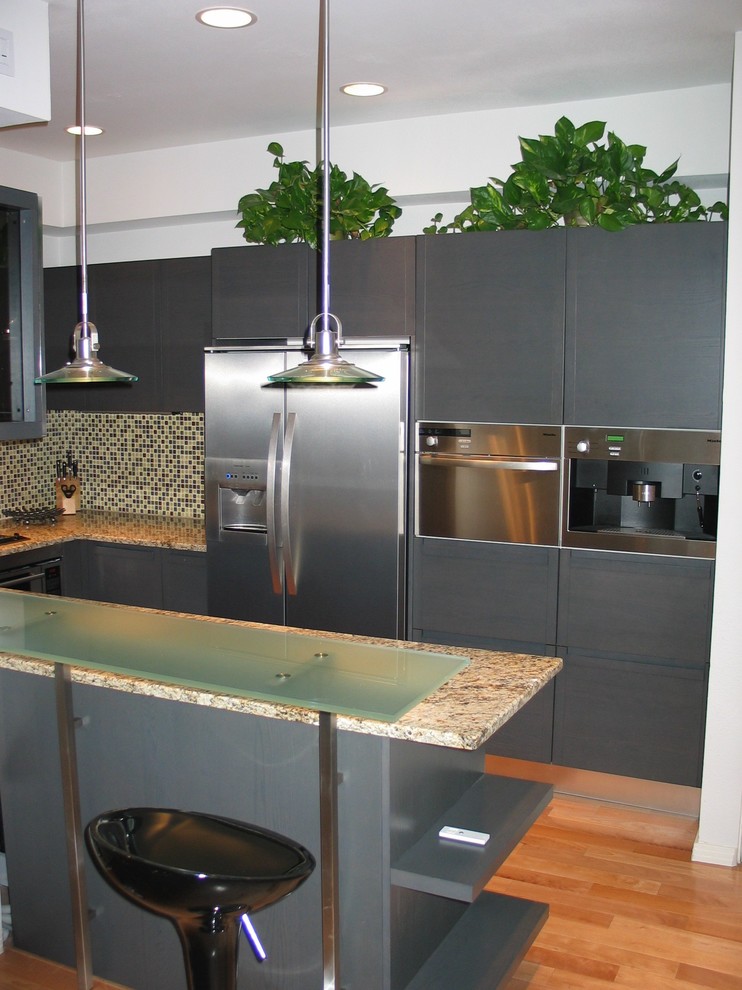 Design ideas for a small modern u-shaped separate kitchen in San Diego with a double-bowl sink, flat-panel cabinets, grey cabinets, granite benchtops, multi-coloured splashback, mosaic tile splashback, stainless steel appliances, medium hardwood floors and no island.