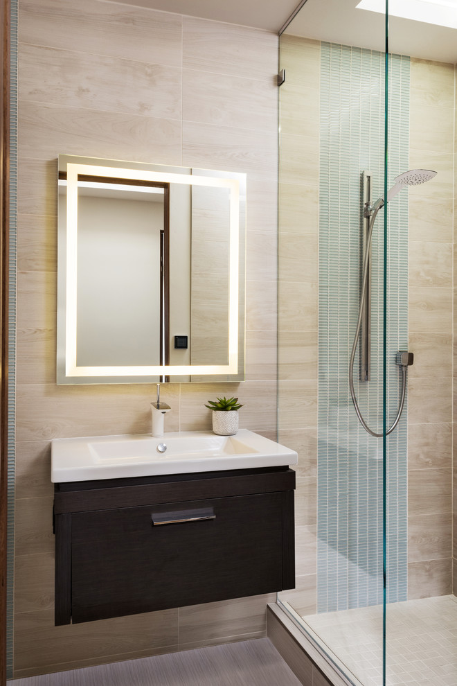 Mid-sized contemporary 3/4 bathroom in San Diego with flat-panel cabinets, dark wood cabinets, an alcove shower, a one-piece toilet, beige tile, porcelain tile, white walls, porcelain floors, an integrated sink, solid surface benchtops, beige floor and an open shower.