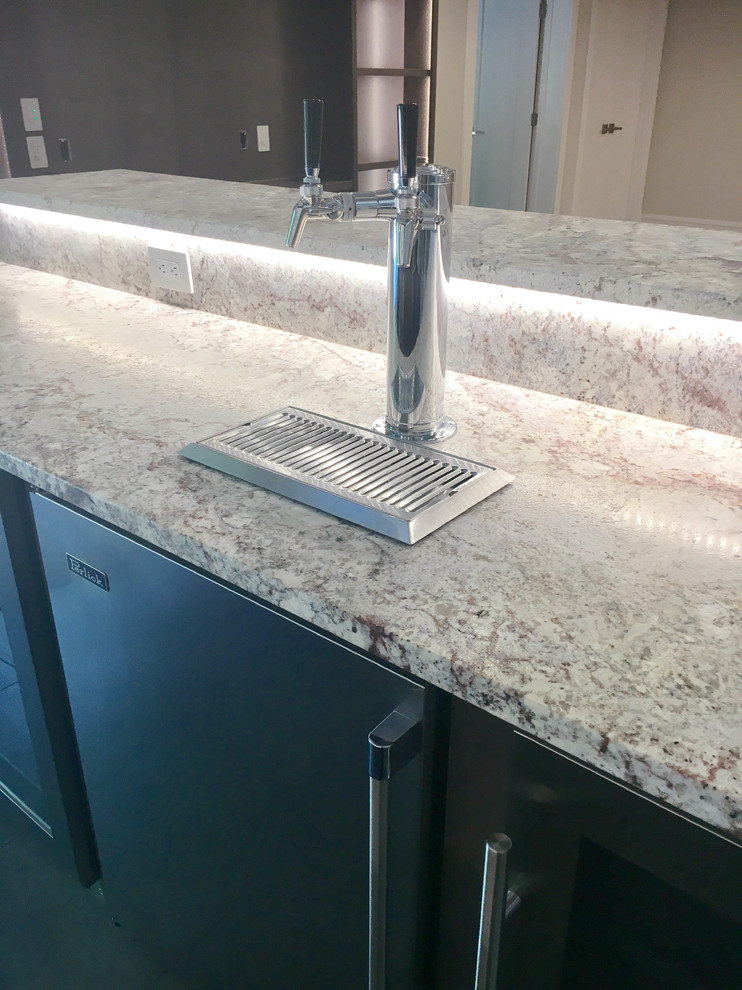 Large transitional wet bar in Other with an undermount sink, flat-panel cabinets, grey cabinets and granite benchtops.