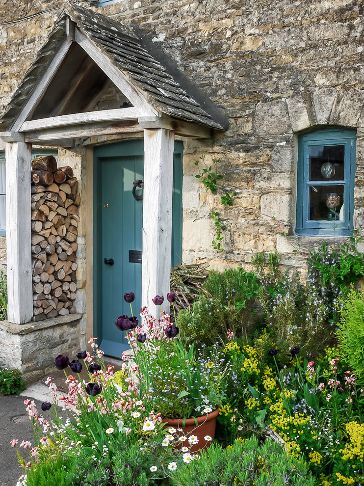Inspiration for a country entryway in Oxfordshire with a single front door, a blue front door and grey walls.