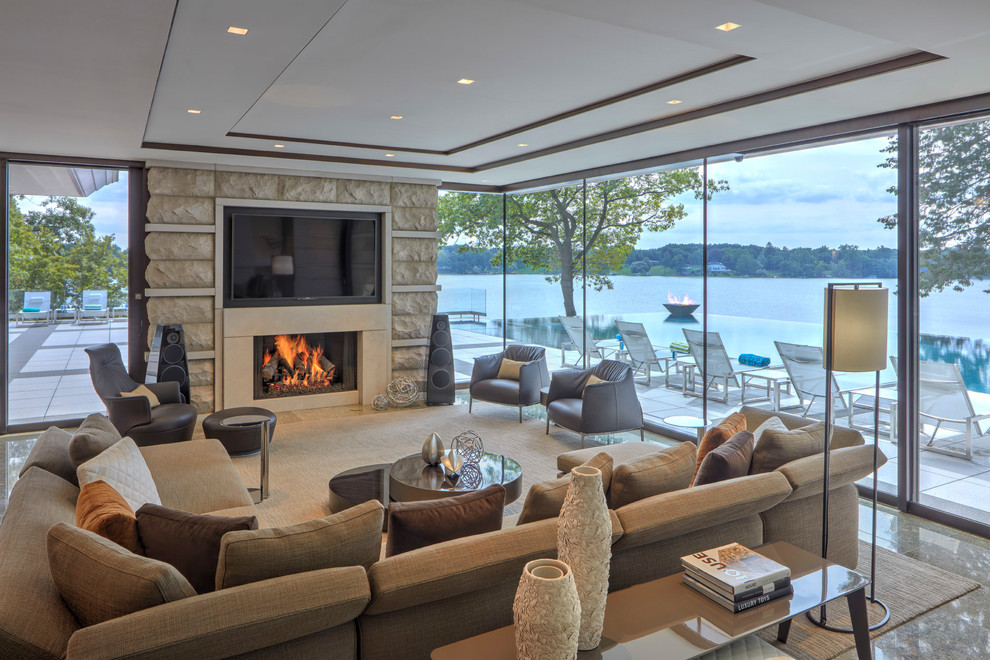 Living room - contemporary living room idea in Detroit with a standard fireplace, a stone fireplace and a wall-mounted tv