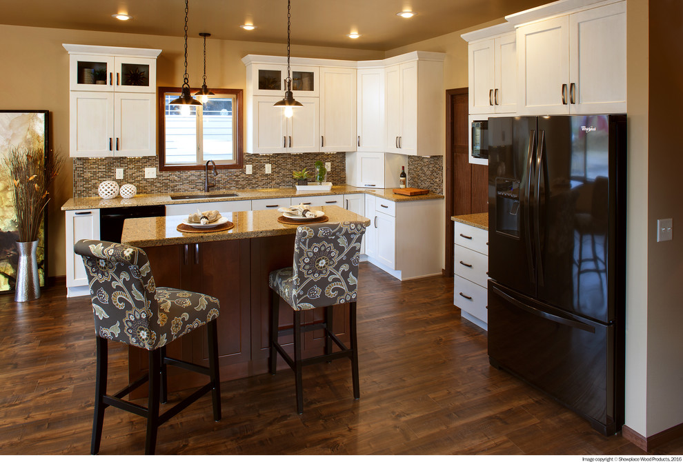 Inspiration for a l-shaped kitchen remodel with black appliances and an island