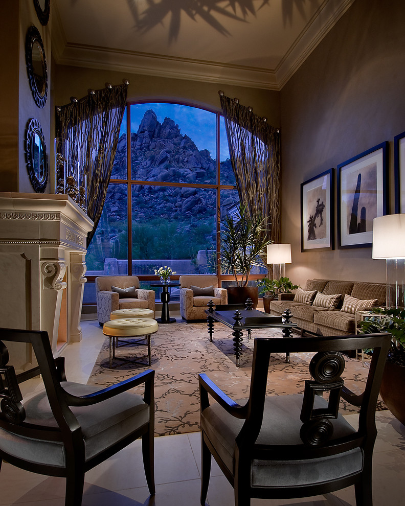 This is an example of a traditional living room in Phoenix with grey walls, a standard fireplace and no tv.