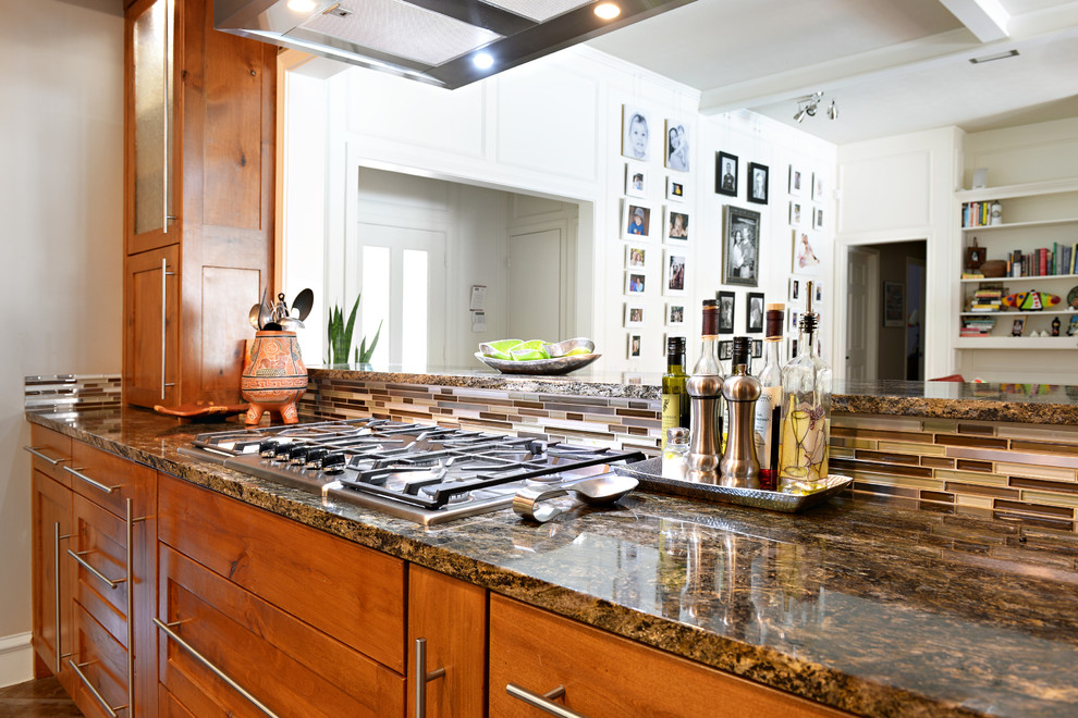 Example of a large transitional u-shaped travertine floor eat-in kitchen design in Dallas with a farmhouse sink, medium tone wood cabinets, granite countertops, multicolored backsplash, matchstick tile backsplash, stainless steel appliances and a peninsula
