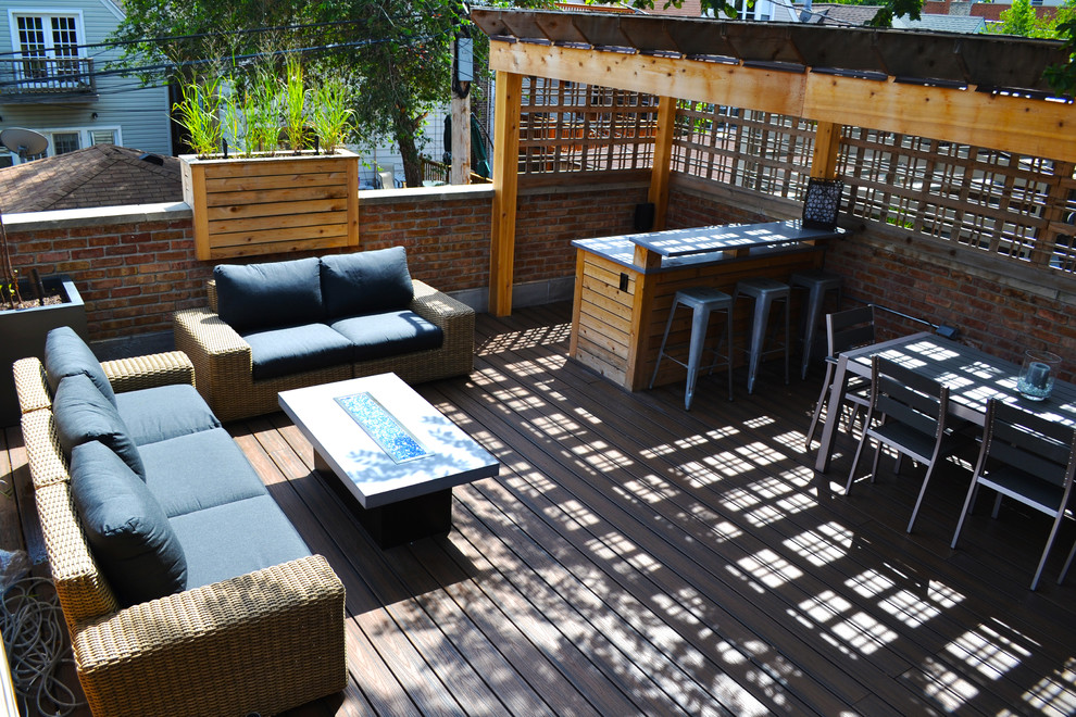 Small transitional rooftop deck in Chicago with a fire feature and a pergola.