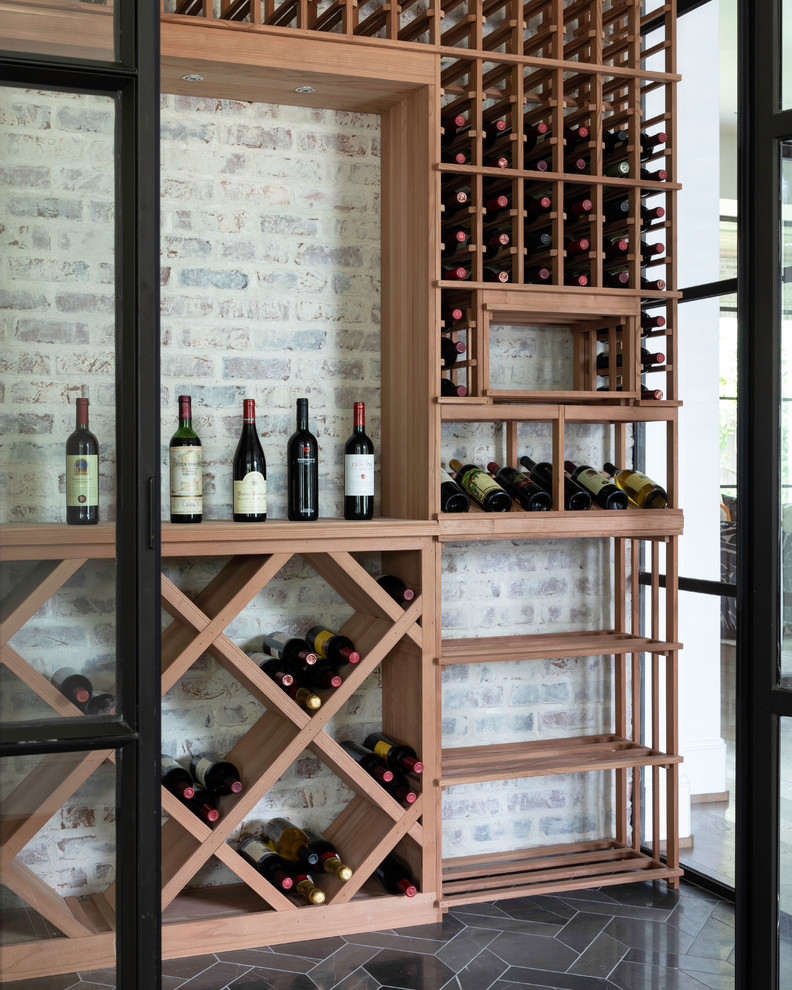 Inspiration for an expansive contemporary wine cellar in Houston with marble floors and black floor.