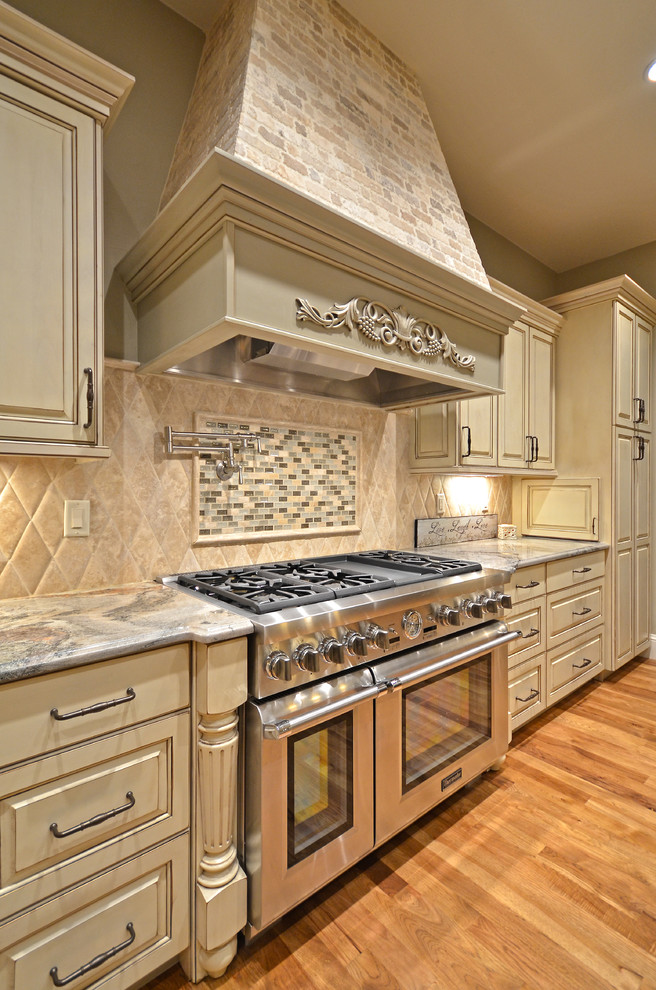 Photo of a traditional l-shaped kitchen in Denver with with island.