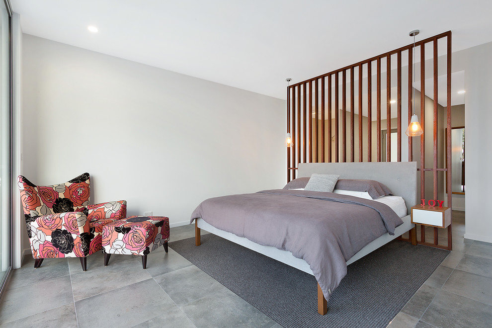 Inspiration for a mid-sized modern master bedroom in Sydney with white walls and ceramic floors.
