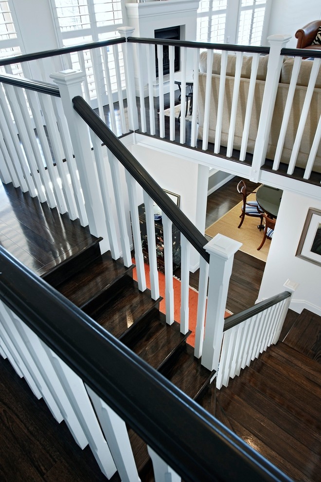 This is an example of a large traditional wood u-shaped staircase in Perth with wood risers.