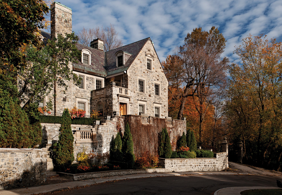 This is an example of a traditional exterior in Montreal with stone veneer.